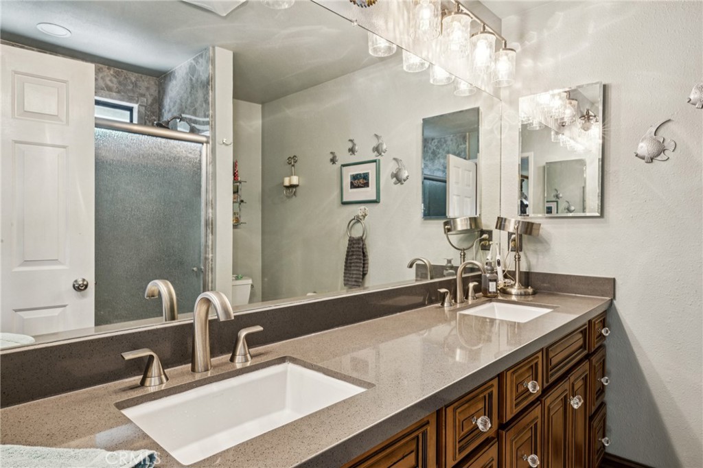 7050 Shale Rock Road Paso Robles, CA 93446 - Photo 20 of 45 a bathroom with a sink double vanity and a mirror