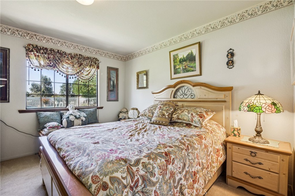 7050 Shale Rock Road Paso Robles, CA 93446 - Photo 22 of 45 a bedroom with a large bed and a window