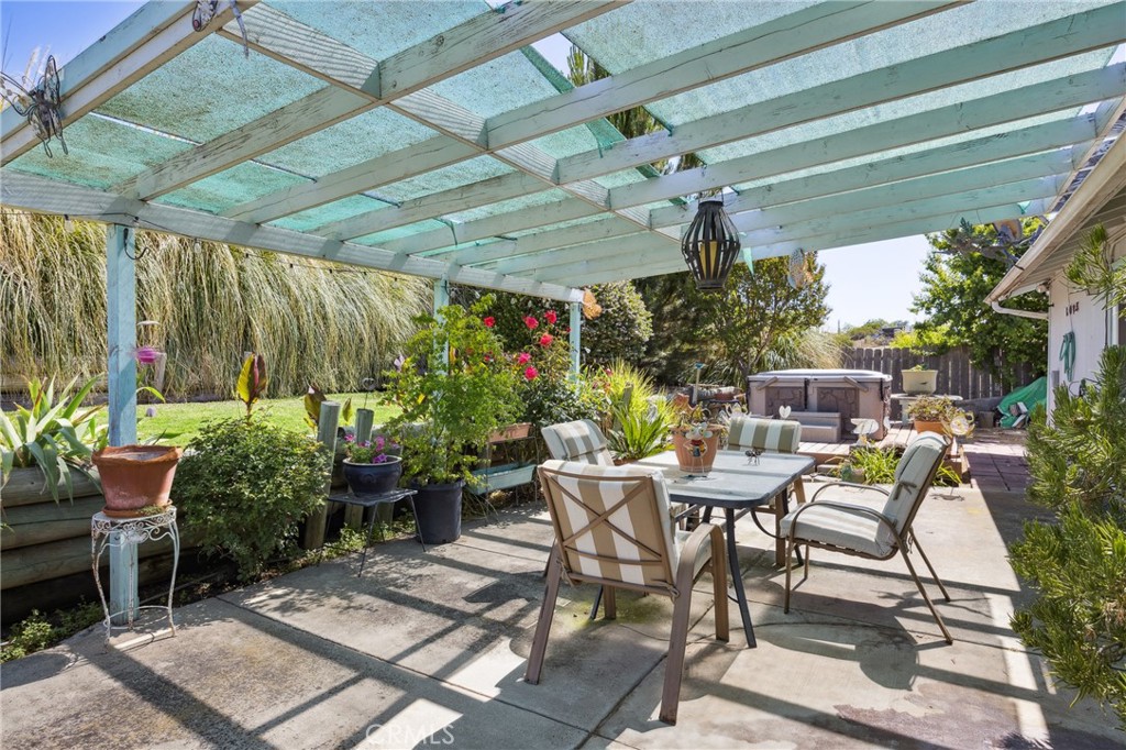 7050 Shale Rock Road Paso Robles, CA 93446 - Photo 26 of 45 a view of a patio with table and chairs potted plants