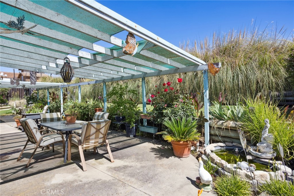 7050 Shale Rock Road Paso Robles, CA 93446 - Photo 28 of 45 a view of a patio with table and chairs potted plants