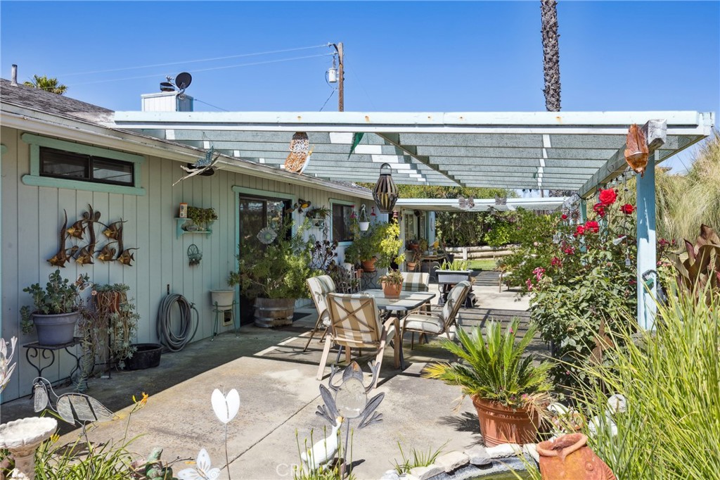 7050 Shale Rock Road Paso Robles, CA 93446 - Photo 29 of 45 a view of a patio with table and chairs potted plants