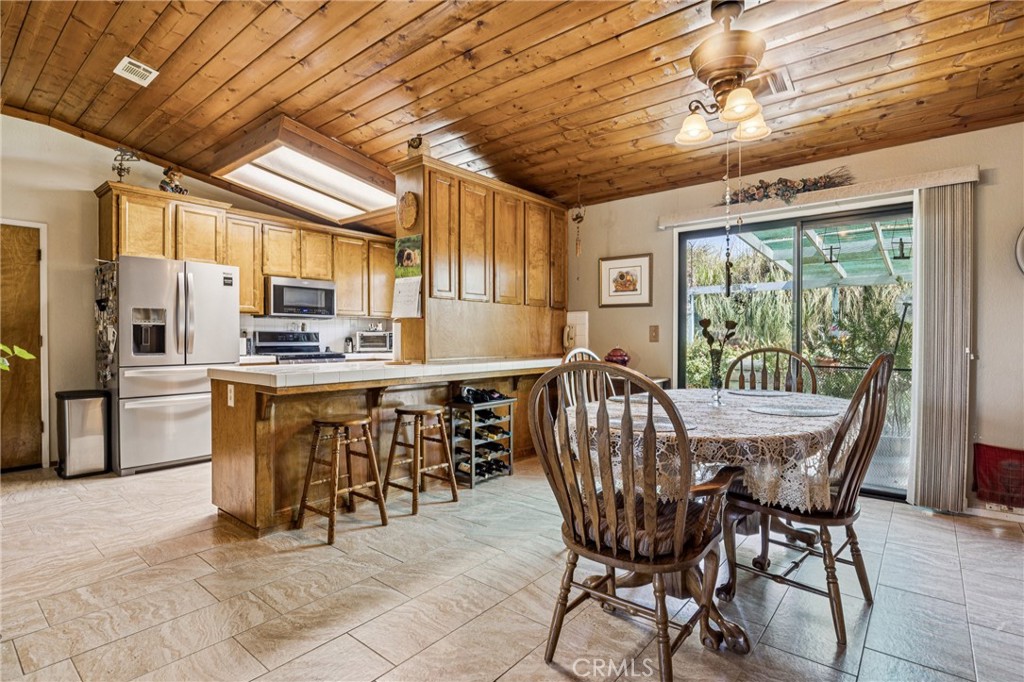 7050 Shale Rock Road Paso Robles, CA 93446 - Photo 6 of 45 a view of a dining room with furniture window and outside view