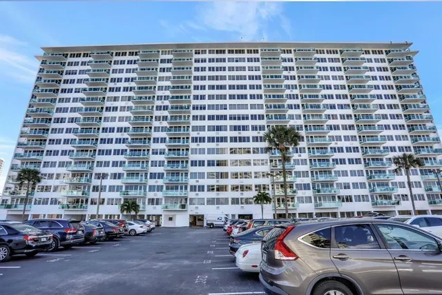 a view of bedroom with a bed and a painting on the wall