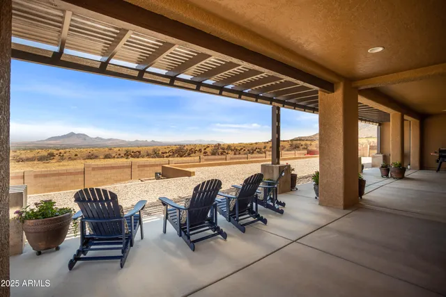 a view of a terrace with couches and wooden floor