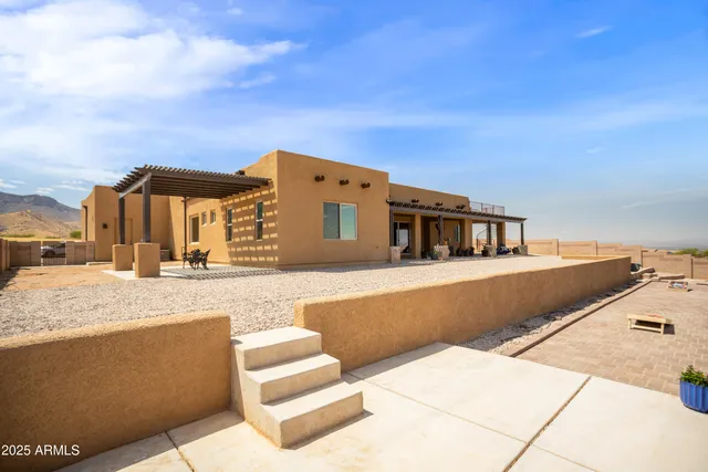 a view of a mountain with an ocean beach