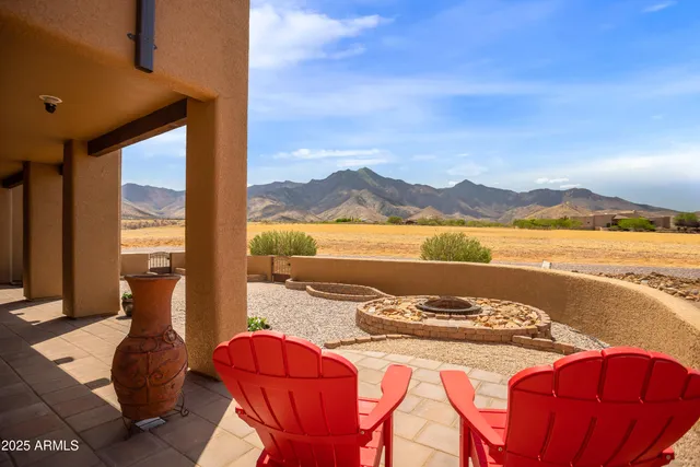 a view of a balcony with chair and table