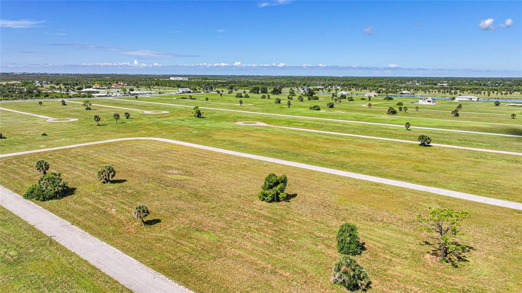 37 Willow Road Placida, FL 33946 - Photo 9 of 11 a view of an swimming pool and a lake view