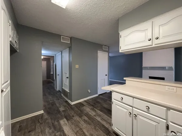 a view of a storage and utility room with closet