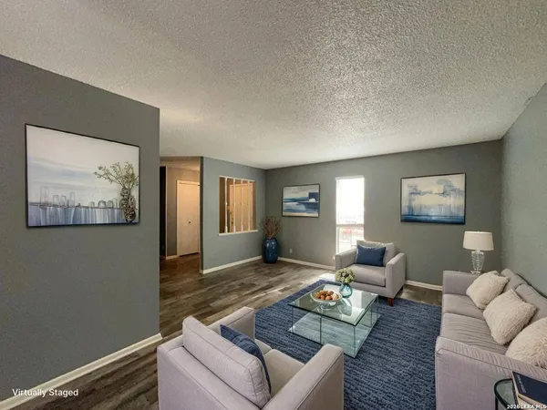 a living room with furniture and a window