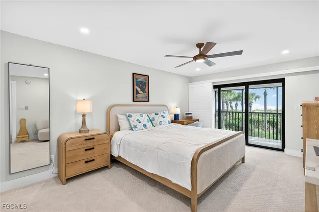 a bedroom with a bed and a ceiling fan