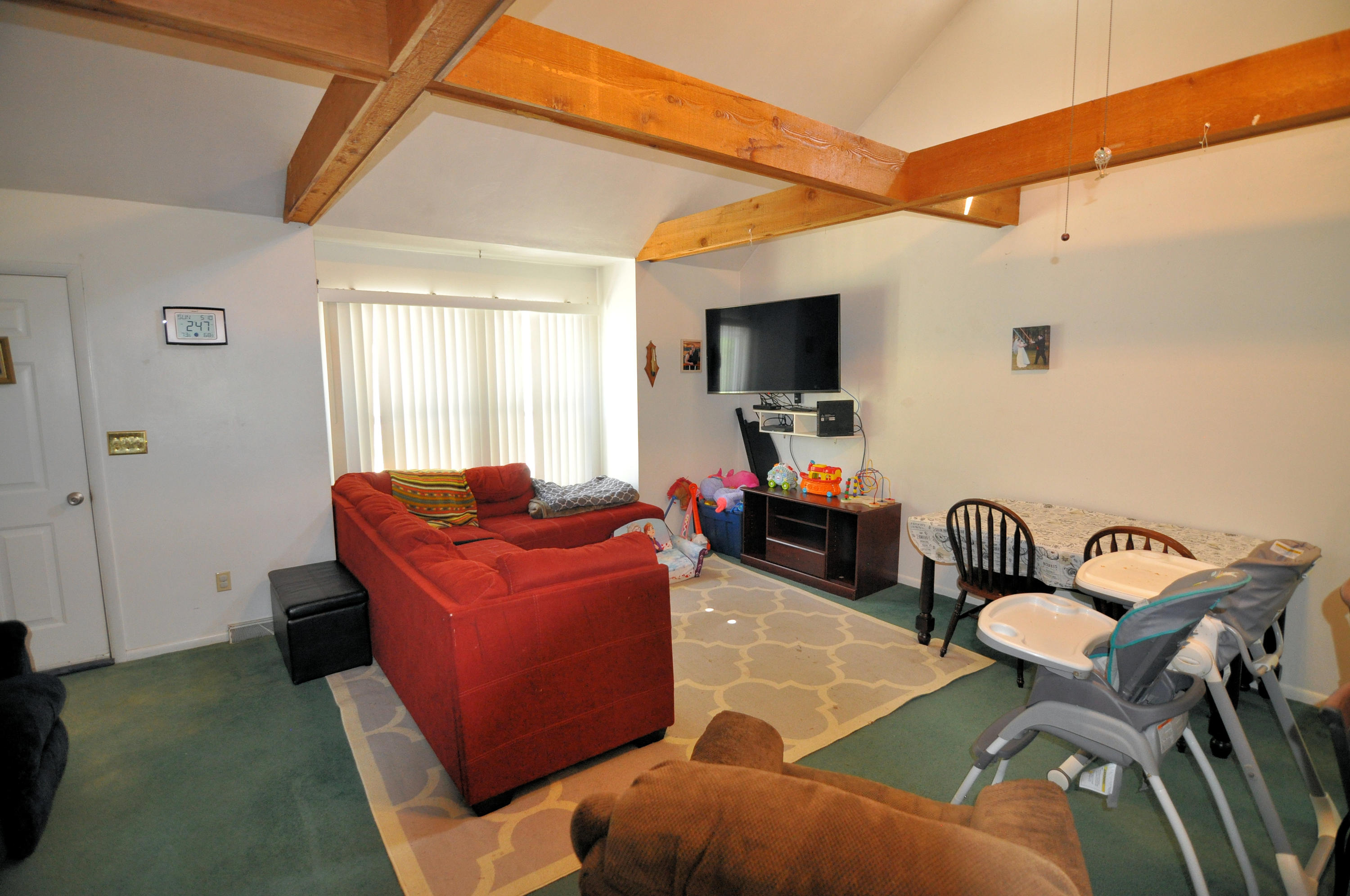 570 Zimmerman Road Blue Ridge, VA 24064 - Photo 11 of 24 a living room with furniture a flat screen tv and a window