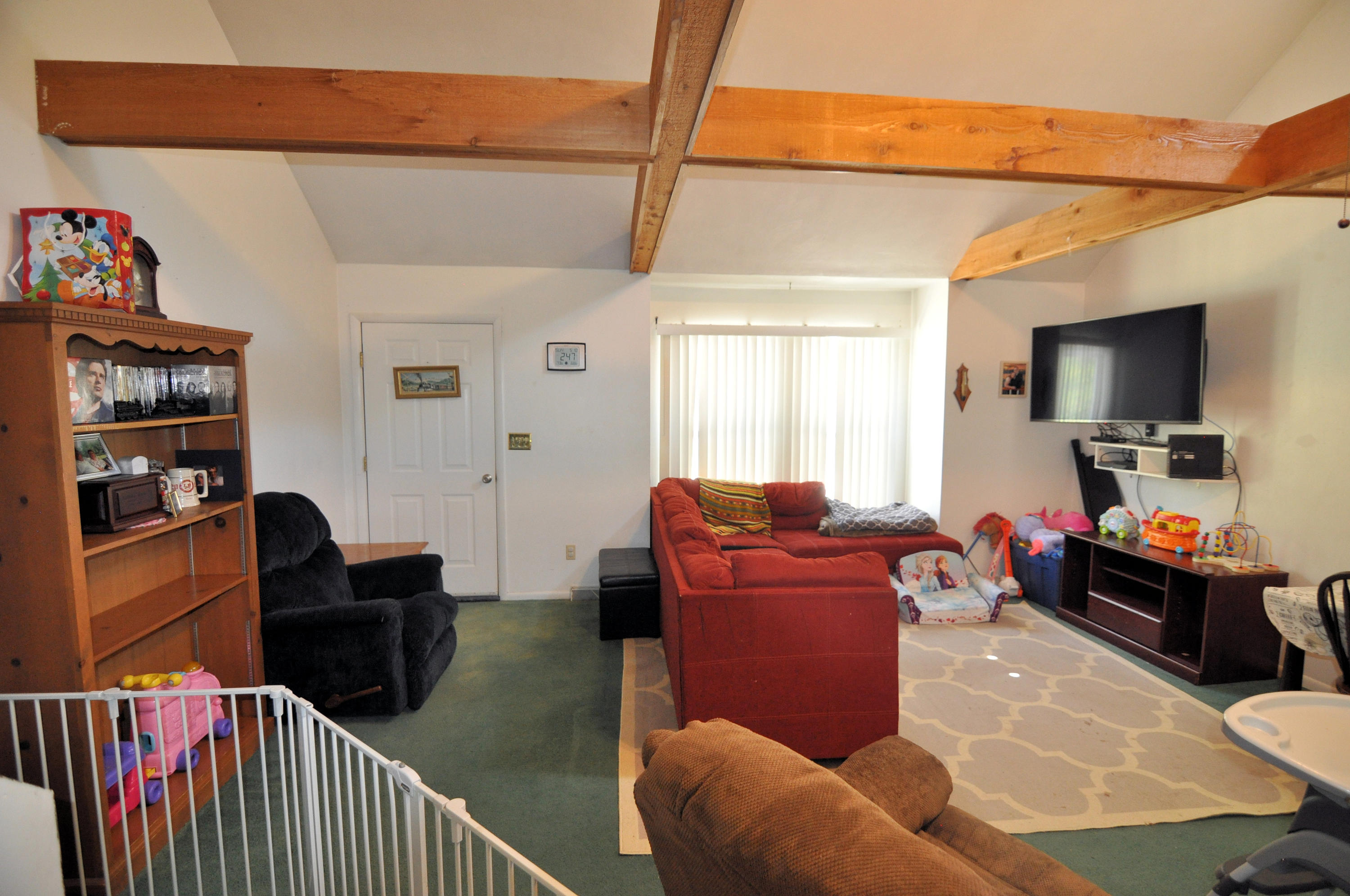 570 Zimmerman Road Blue Ridge, VA 24064 - Photo 24 of 24 a living room with furniture a flat screen tv and dresser