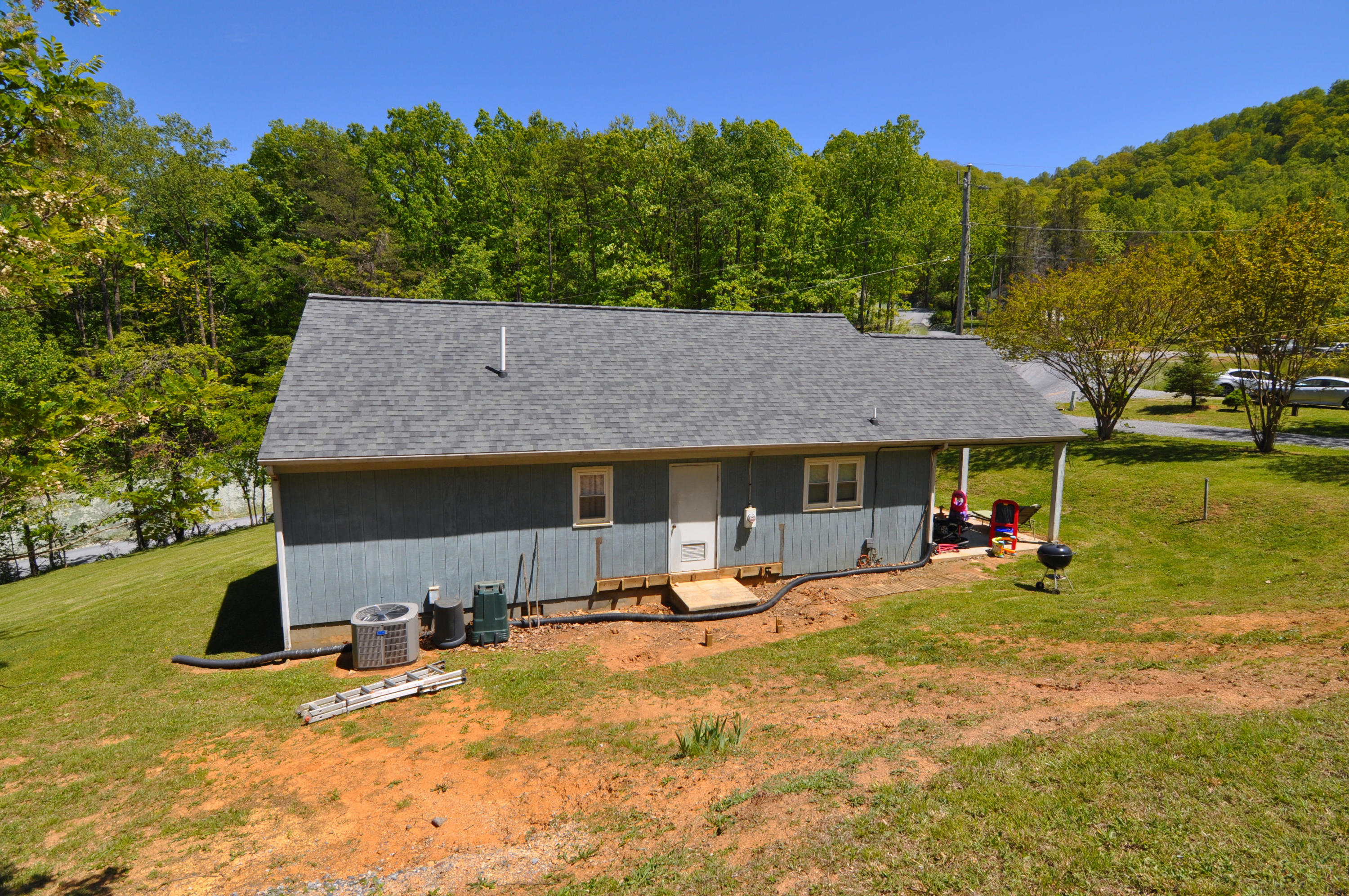 570 Zimmerman Road Blue Ridge, VA 24064 - Photo 9 of 24 a view of a house with swimming pool and sitting area