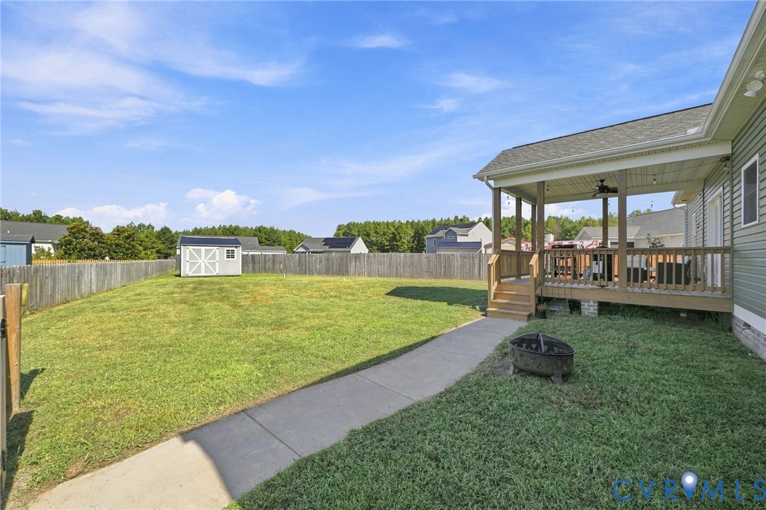 8718 Rock Cedar Road New Kent, VA 23124 - Photo 37 of 43 Expansive backyard featuring a covered porch, deta