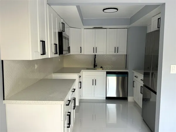 a utility room with washer and dryer