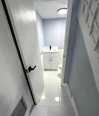 a bathroom with a sink and mirror