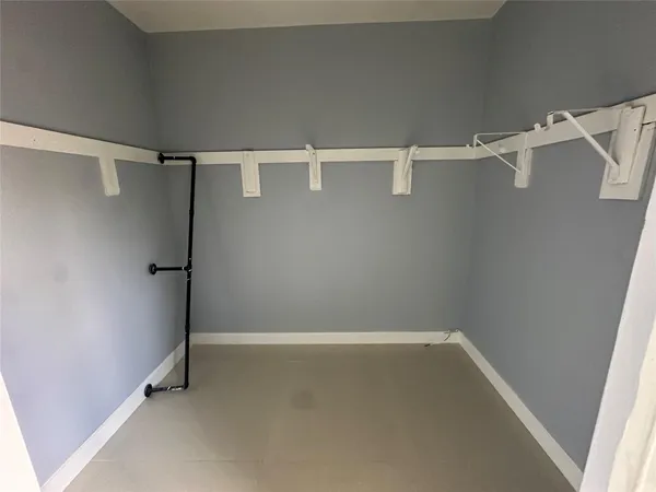 a view of an empty walk in closet