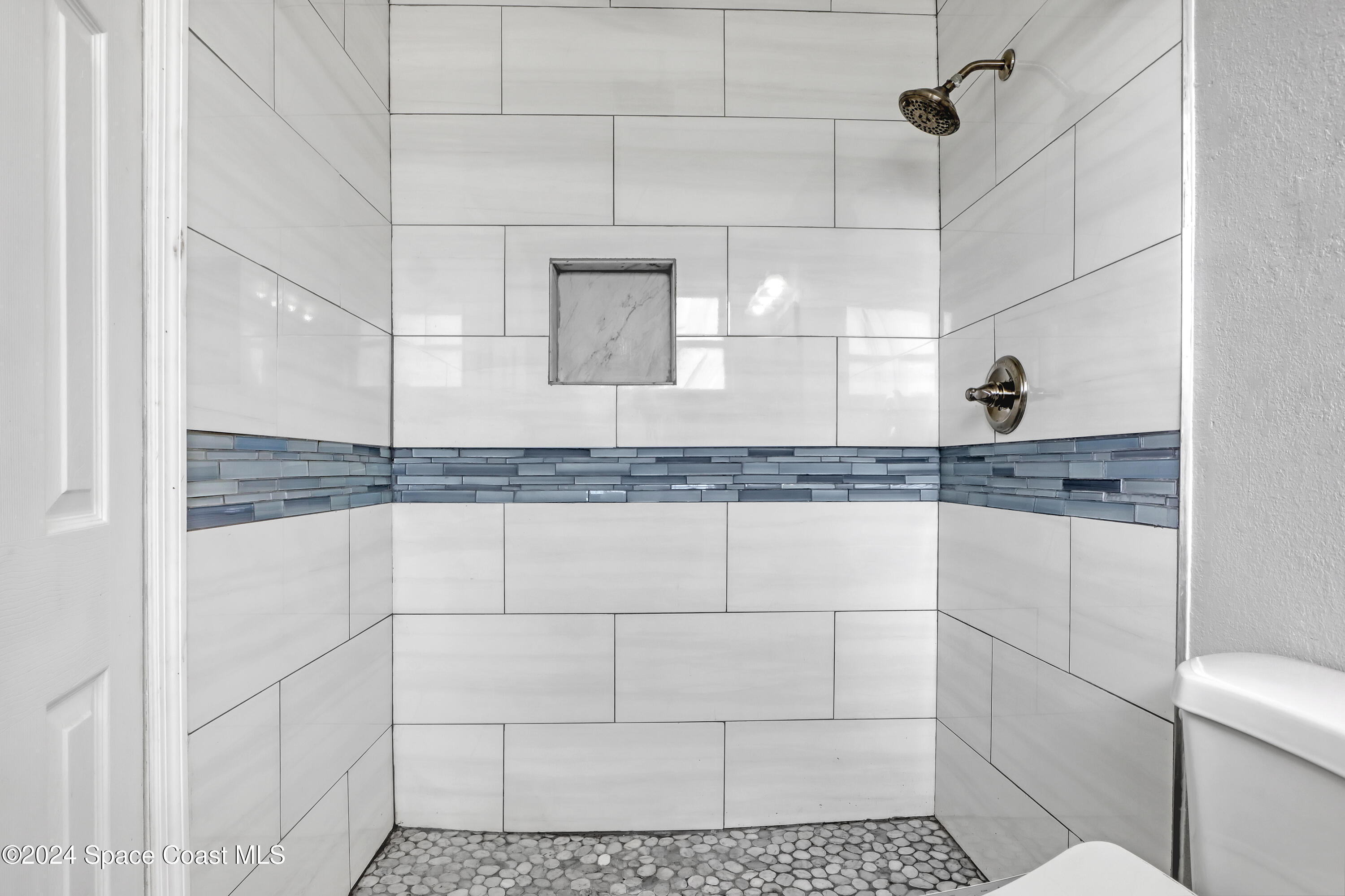 2581 Locksley Road Melbourne, FL 32935 - Photo 21 of 33 a bathroom with a granite countertop shower and a sink