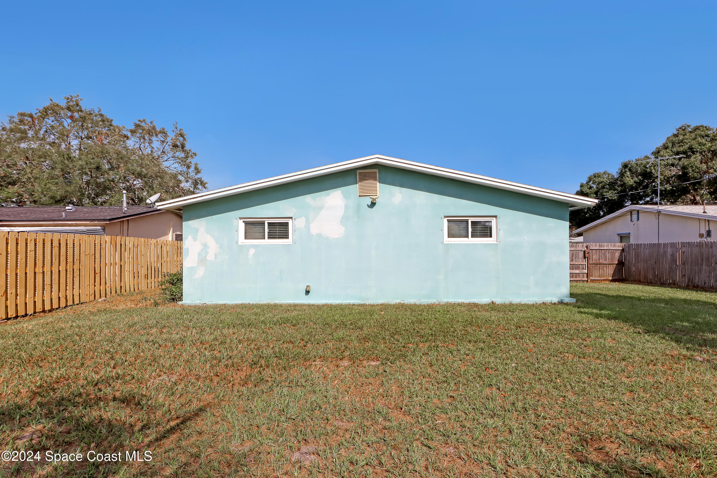 2581 Locksley Road Melbourne, FL 32935 - Photo 28 of 33 a view of a house with a yard