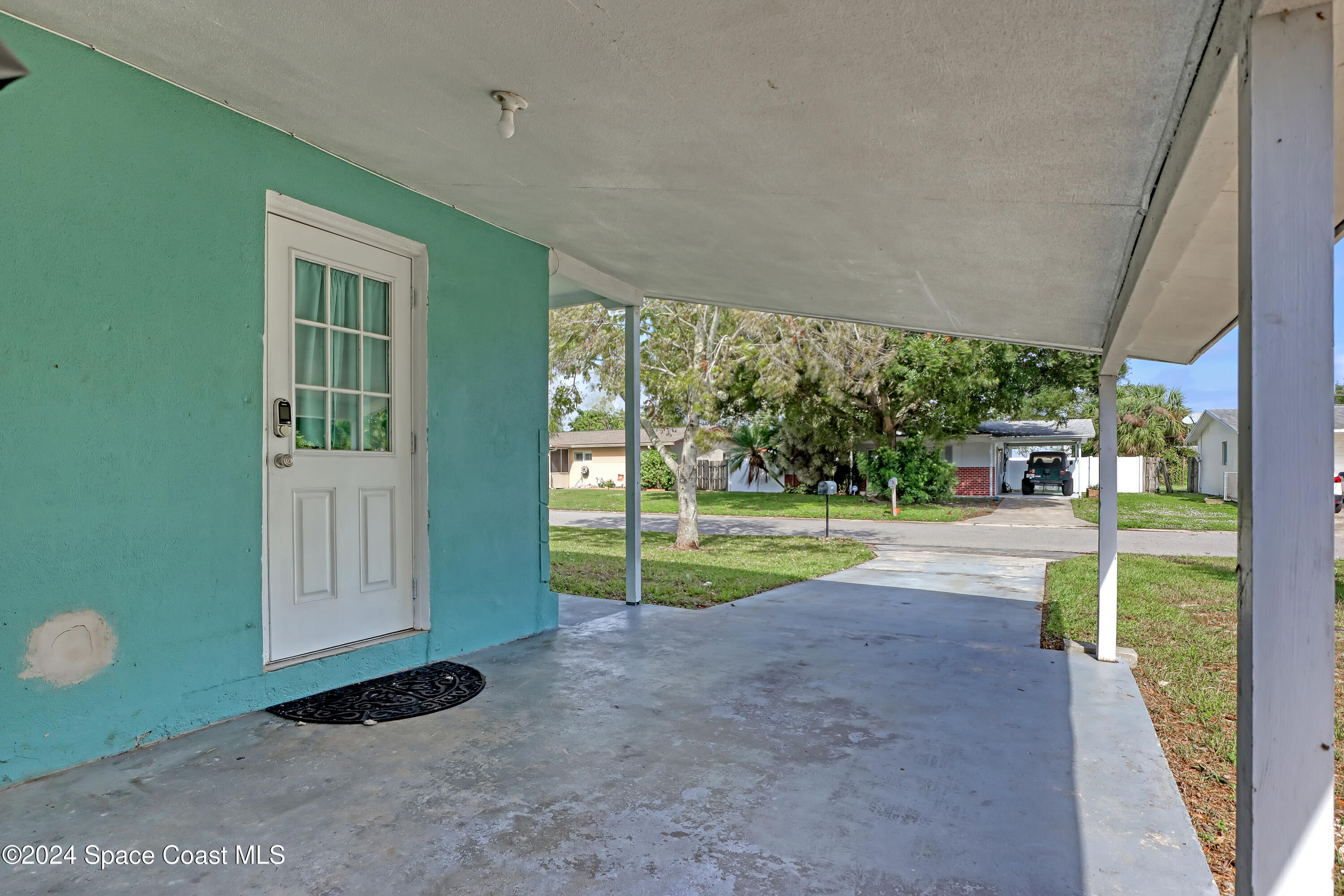 2581 Locksley Road Melbourne, FL 32935 - Photo 3 of 33 a view of a house with backyard and porch