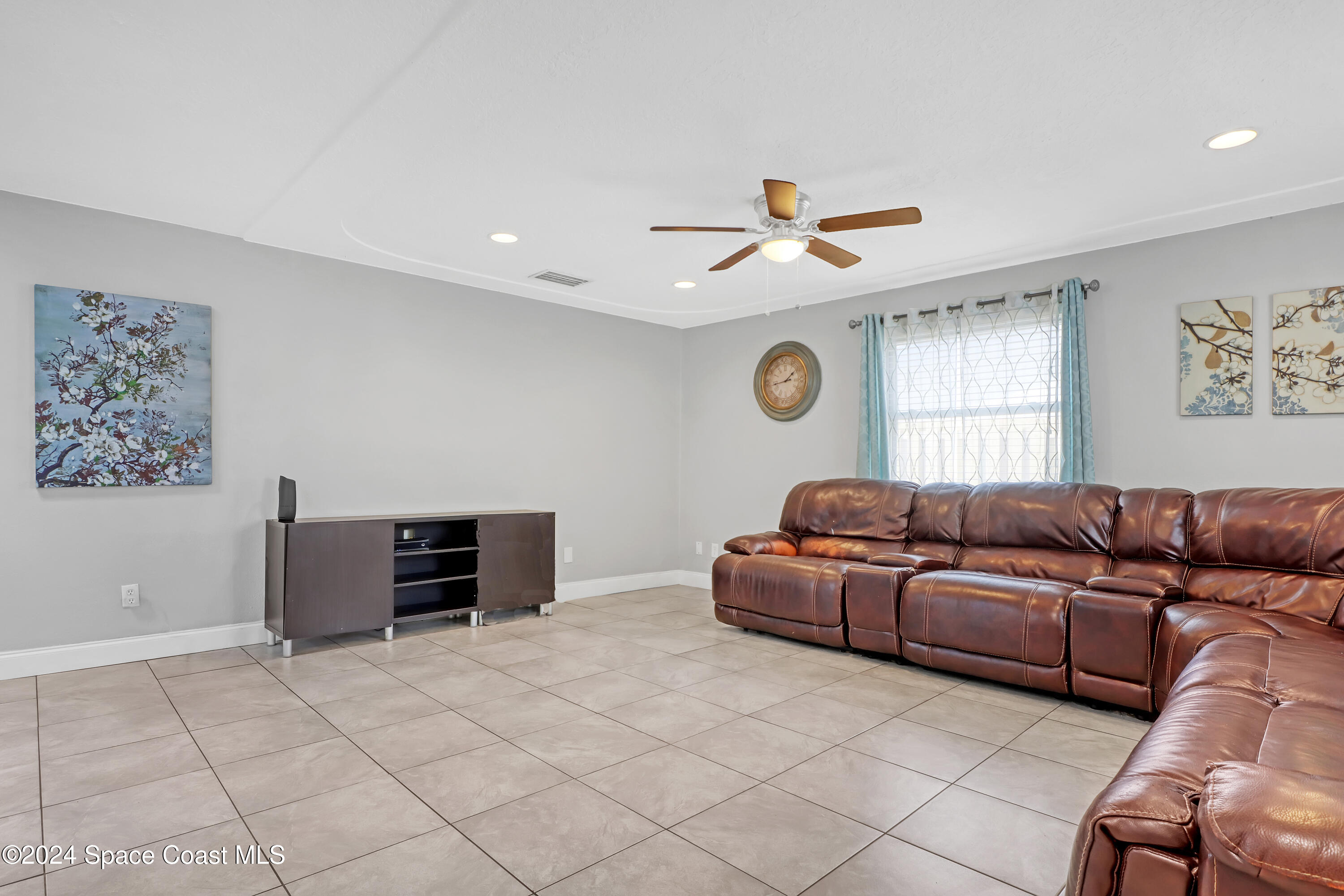 2581 Locksley Road Melbourne, FL 32935 - Photo 7 of 33 a living room with couches and furniture