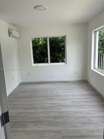 a view of an empty room with a window