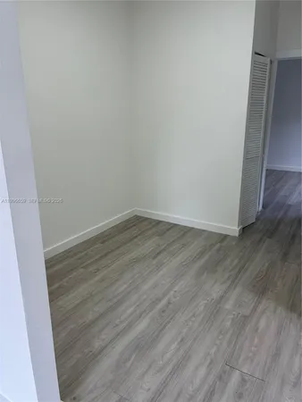 a view of a small space with wooden floor