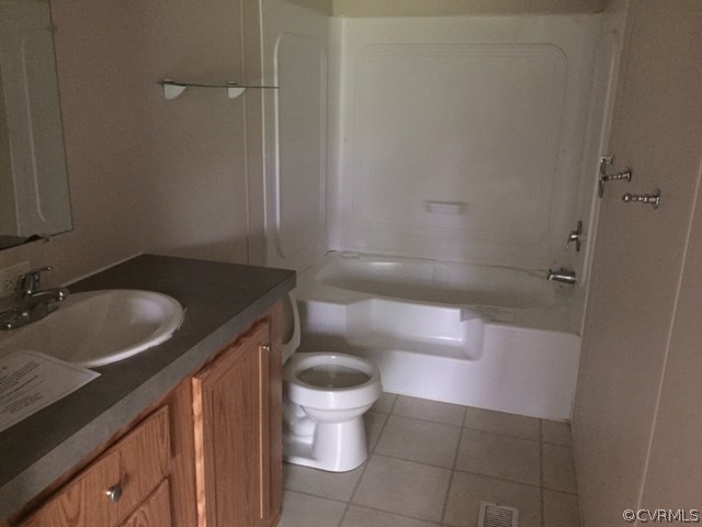 2012 Trivette Road Beaverdam, VA 23015 - Photo 7 of 11 a bathroom with a granite countertop sink toilet and a mirror