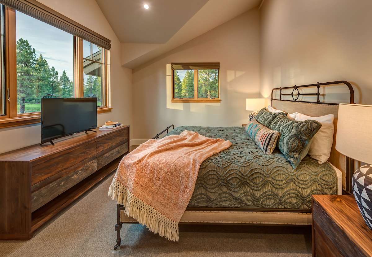 11355 Sutter's Trail, Unit 16 Truckee, CA 96161 - Photo 12 of 21 a bedroom with a bed window and a television