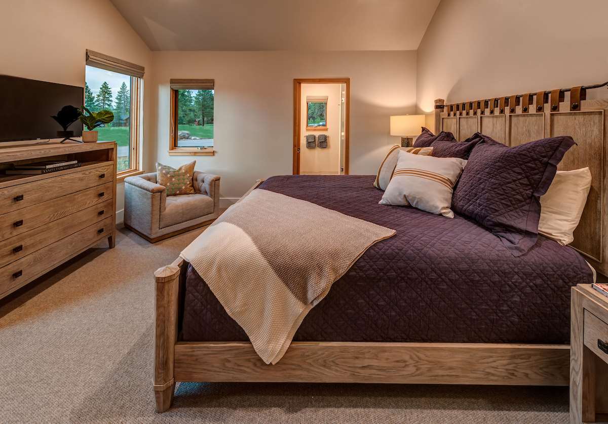 11355 Sutter's Trail, Unit 16 Truckee, CA 96161 - Photo 15 of 21 a bedroom with a bed and a flat screen television