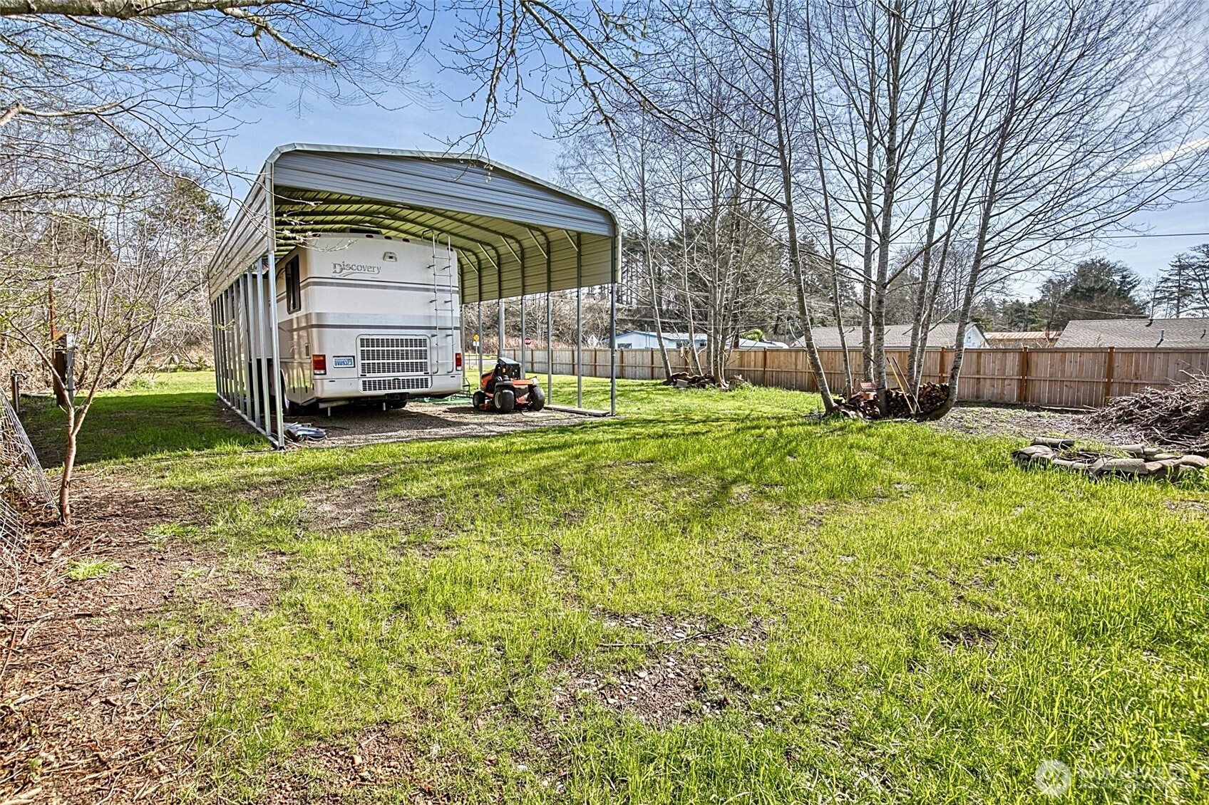 10 5th Avenue Copalis Beach, WA 98535 - Photo 4 of 13 a yellow house sitting in middle of the forest