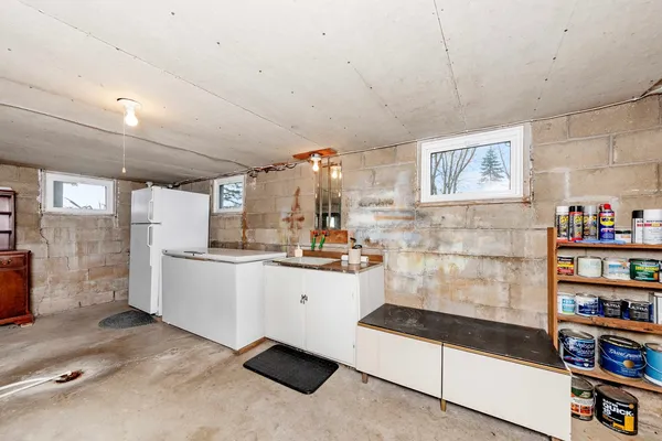 a kitchen with stainless steel appliances a refrigerator and cabinets