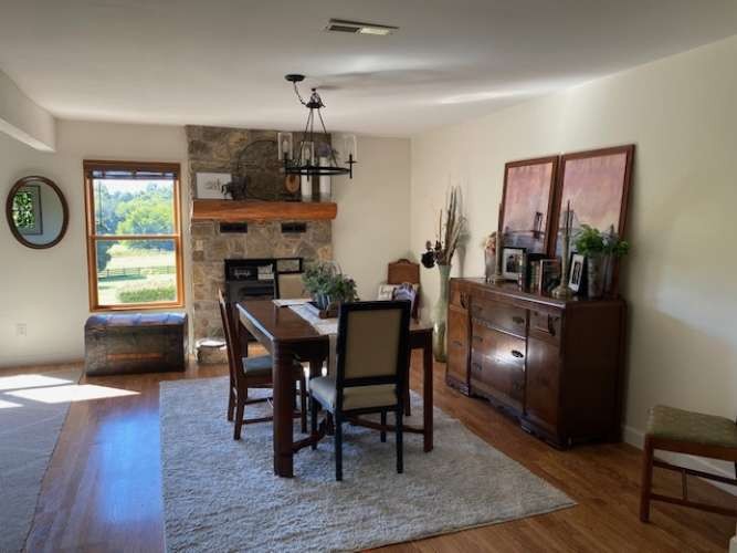 4243 Beech Log Road Lebanon, TN 37090 - Photo 16 of 36 a view of a dining room with furniture window and wooden floor