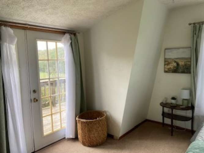 4243 Beech Log Road Lebanon, TN 37090 - Photo 19 of 36 a room with a window and a potted plant on a table