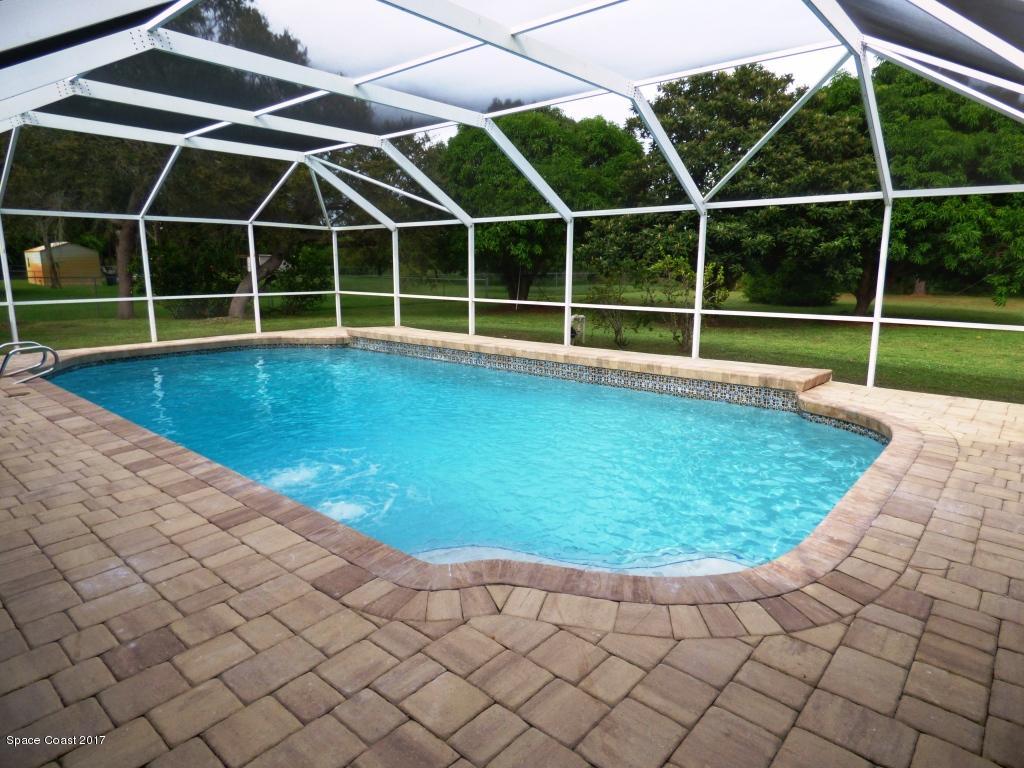 1315 Northeast Tropicana Road Palm Bay, FL 32905 - Photo 3 of 49 a view of a backyard