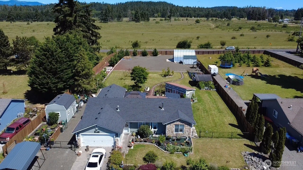 5922 184th Lane Southwest Rochester, WA 98579 - Photo 29 of 34 an aerial view of a house with a lake view
