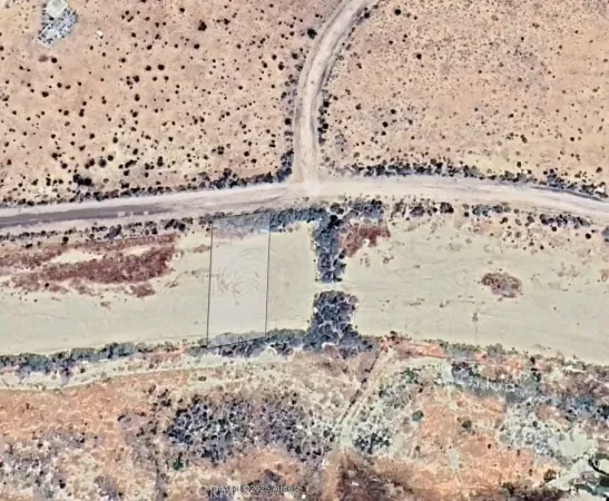 a view of ocean and mountain