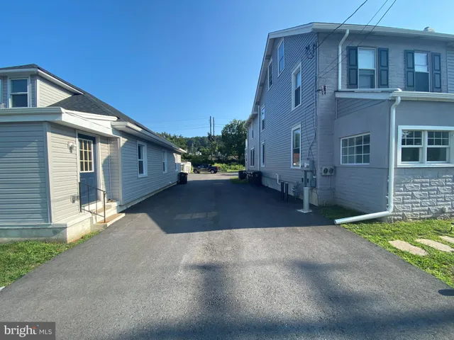 a view of a house with a street