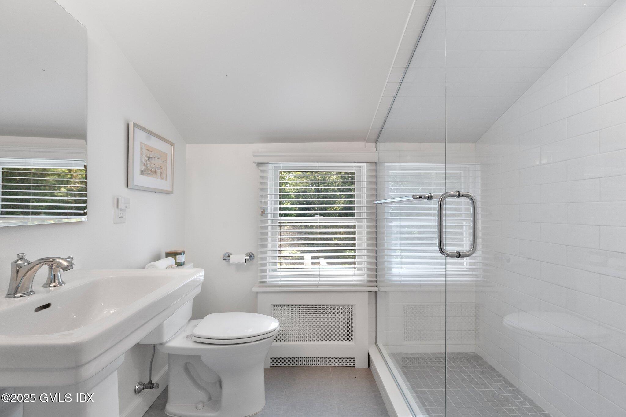 16 Verona Drive Riverside, CT 06878 - Photo 16 of 25 a bathroom with a sink a toilet and shower