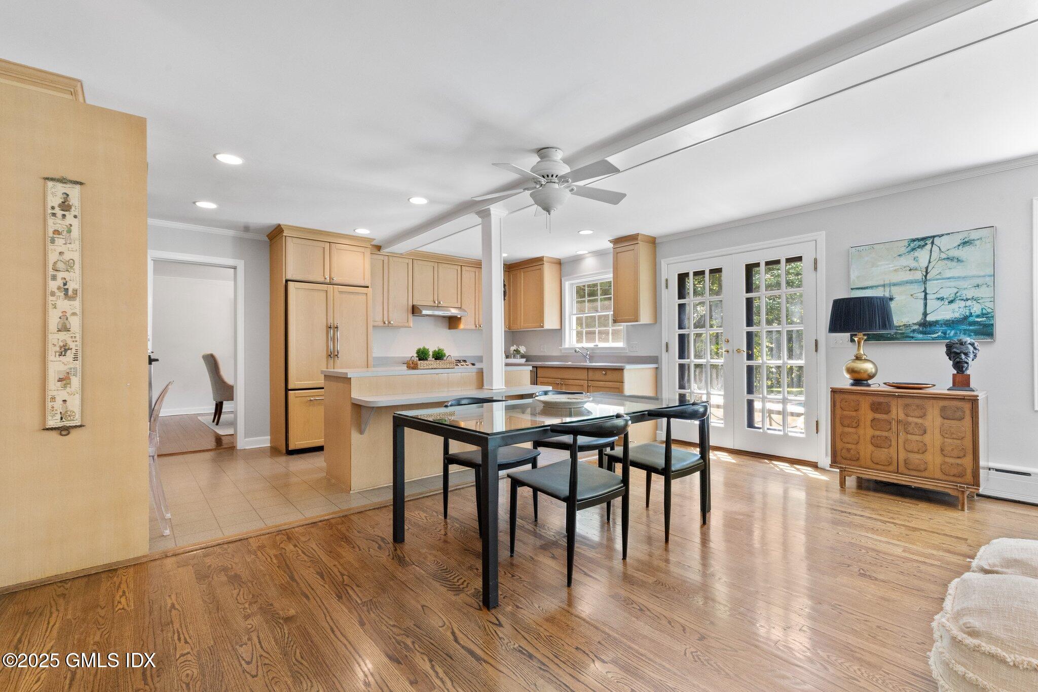 16 Verona Drive Riverside, CT 06878 - Photo 8 of 25 a kitchen with stainless steel appliances wooden floor dining table and chairs