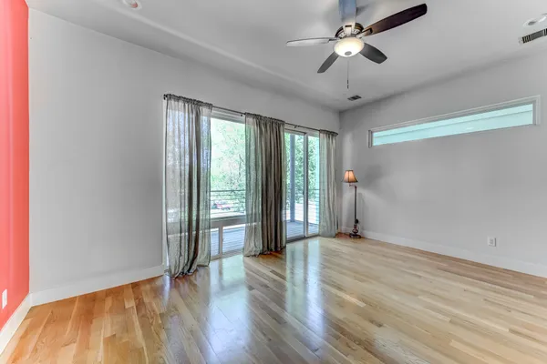 a view of a balcony with wooden floor