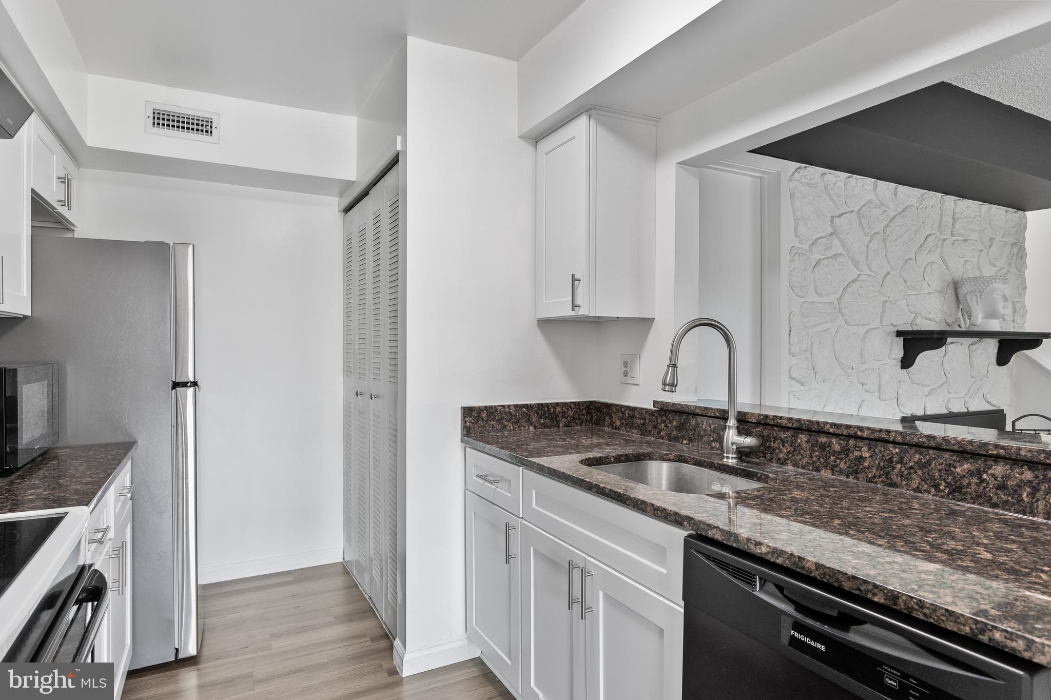 117 Sandra Road Voorhees, NJ 08043 - Photo 11 of 25 a kitchen with stainless steel appliances granite countertop a sink stove and cabinets