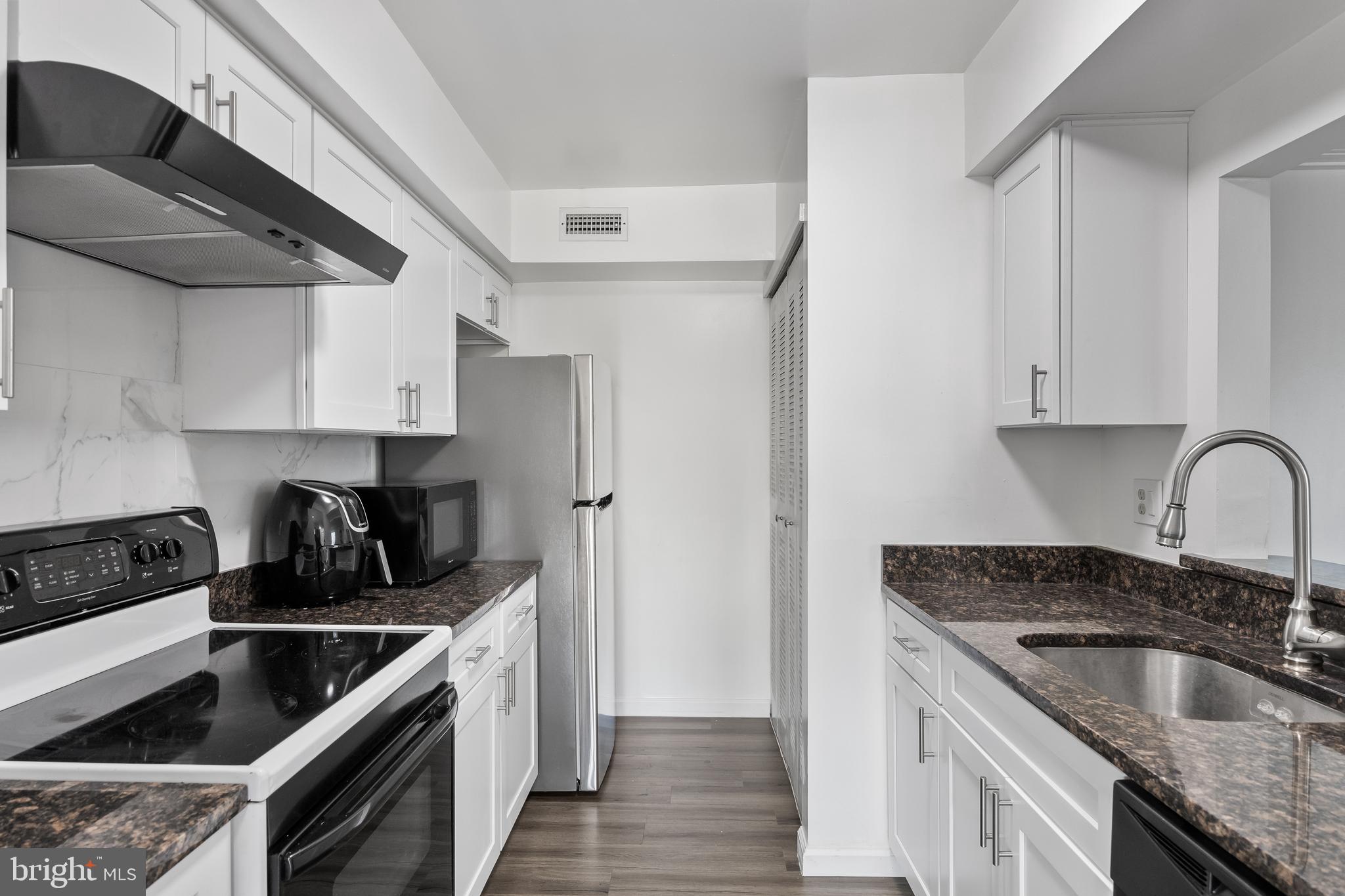 117 Sandra Road Voorhees, NJ 08043 - Photo 12 of 25 a kitchen that has a sink and a stove