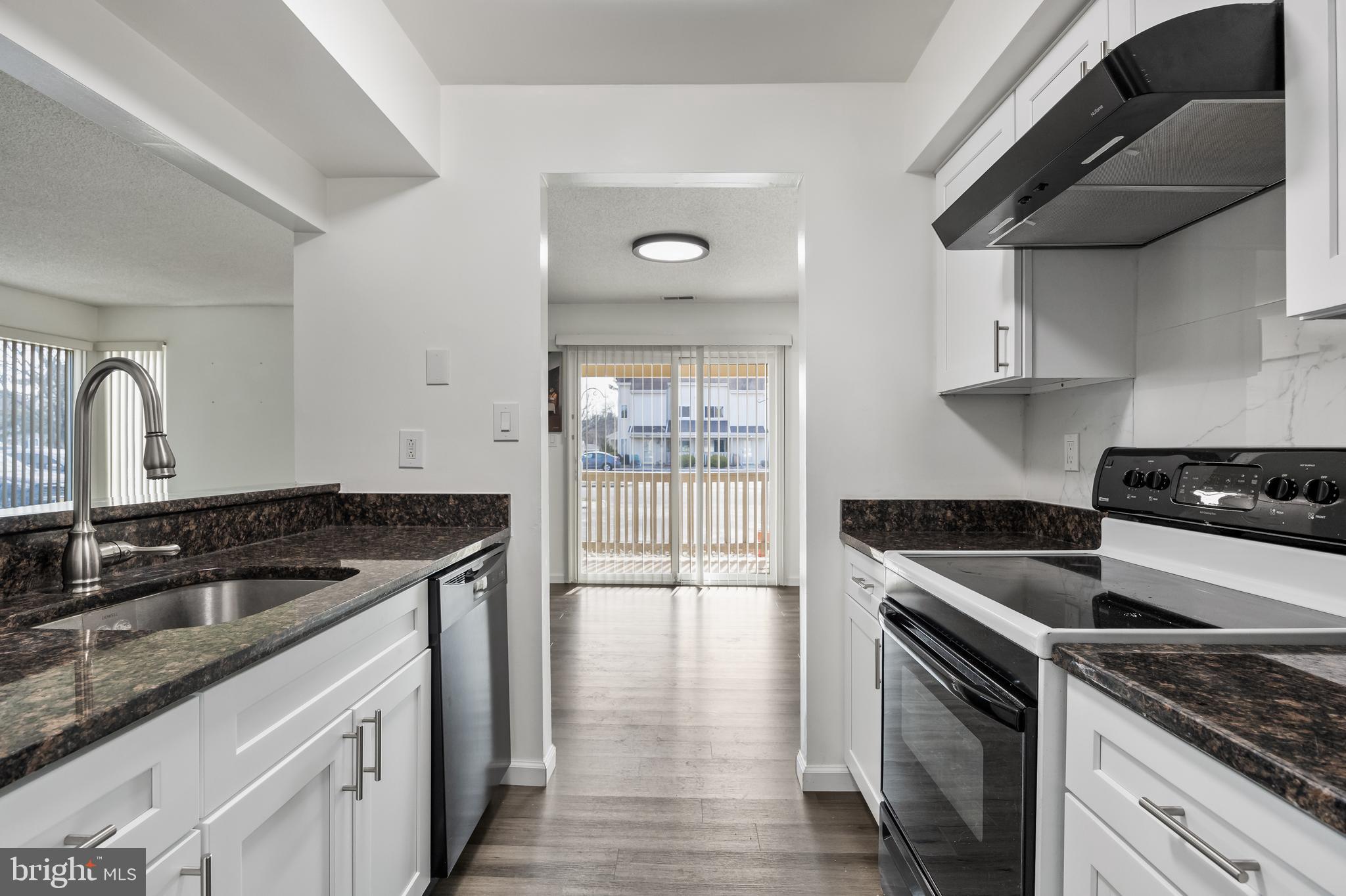 117 Sandra Road Voorhees, NJ 08043 - Photo 14 of 25 a kitchen with granite countertop stainless steel appliances a stove sink and cabinets