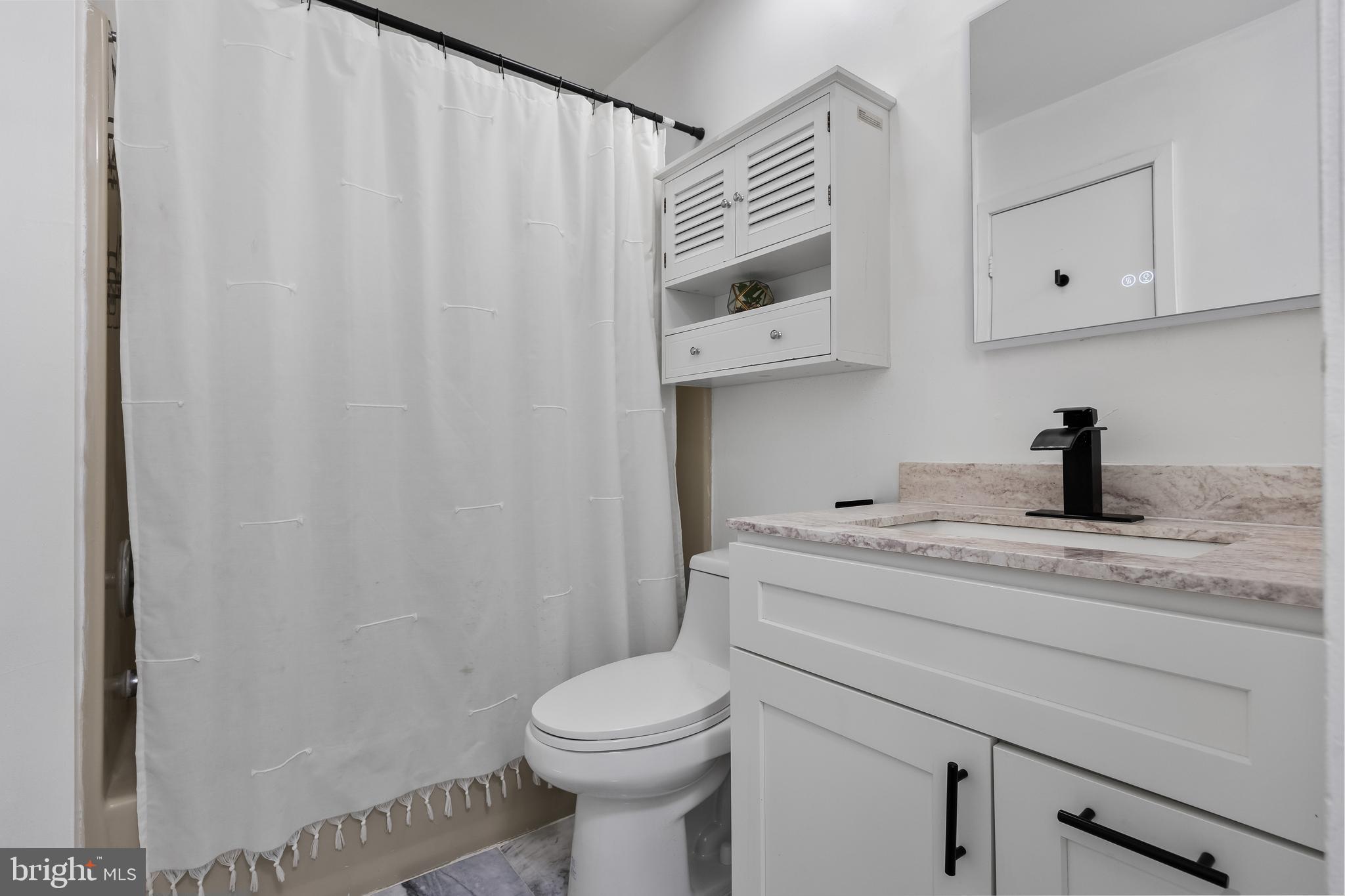 117 Sandra Road Voorhees, NJ 08043 - Photo 22 of 25 a bathroom with a sink a toilet and shower