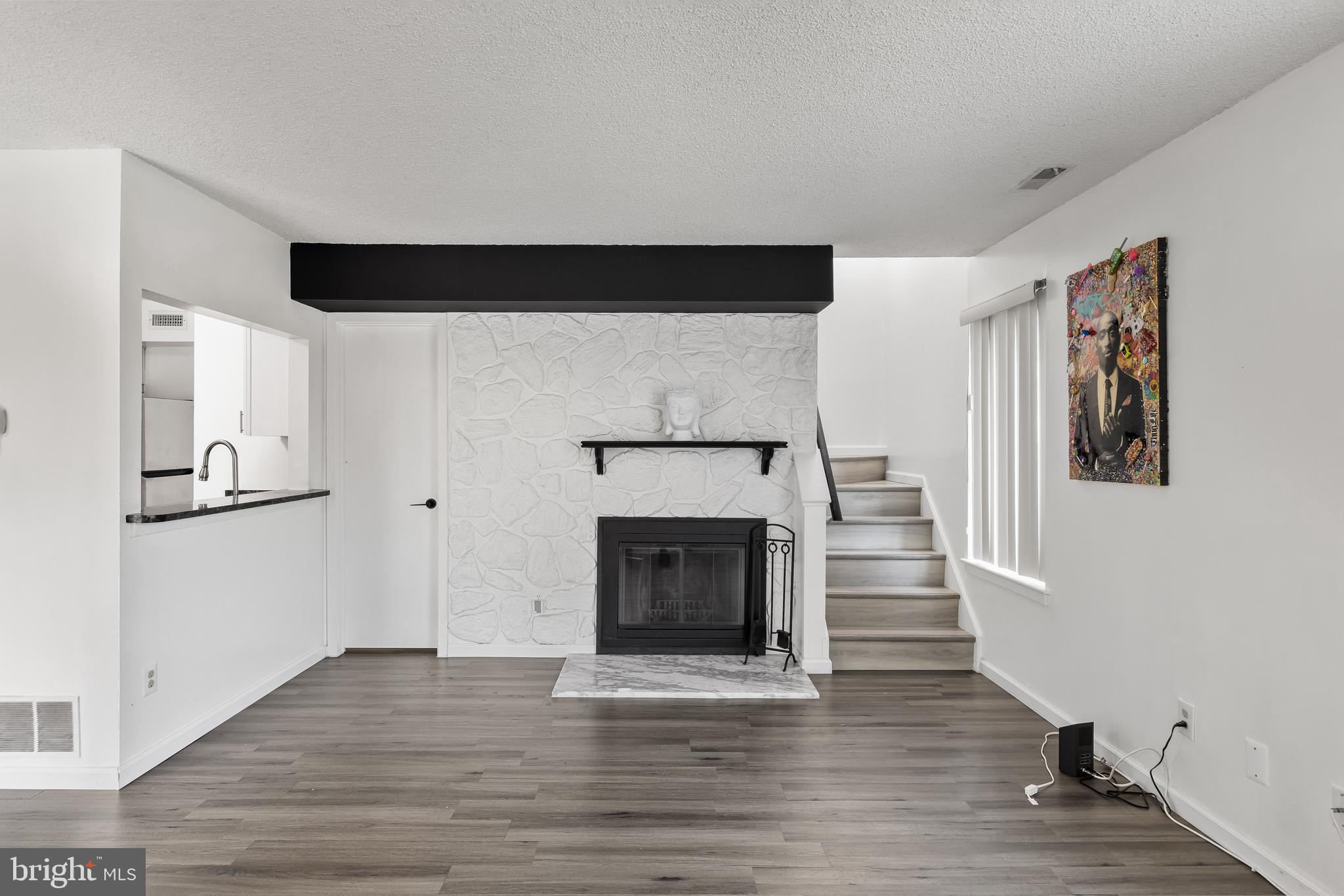 117 Sandra Road Voorhees, NJ 08043 - Photo 5 of 25 a view of a livingroom with an empty space and a fireplace