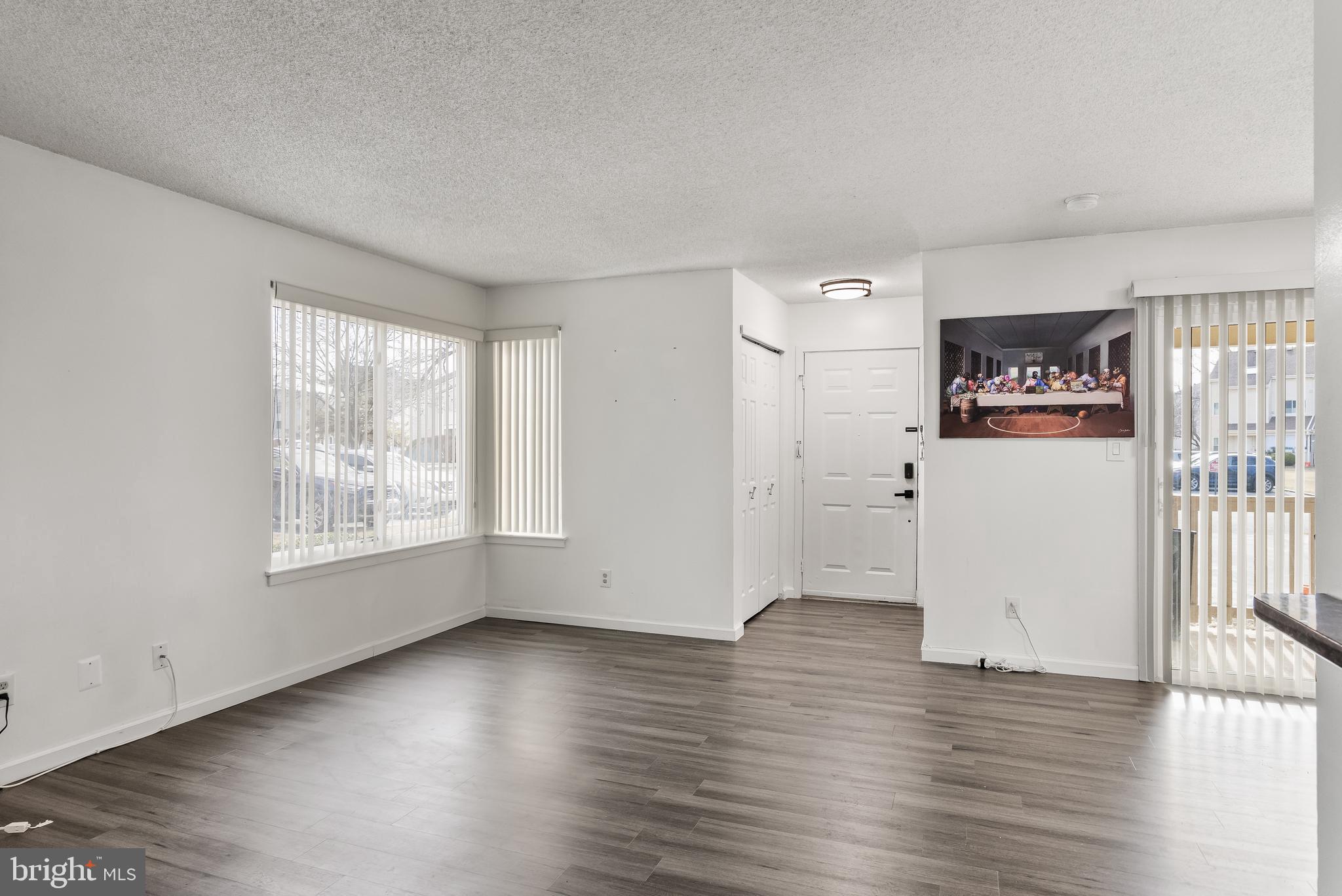 117 Sandra Road Voorhees, NJ 08043 - Photo 7 of 25 an empty room with wooden floor and windows