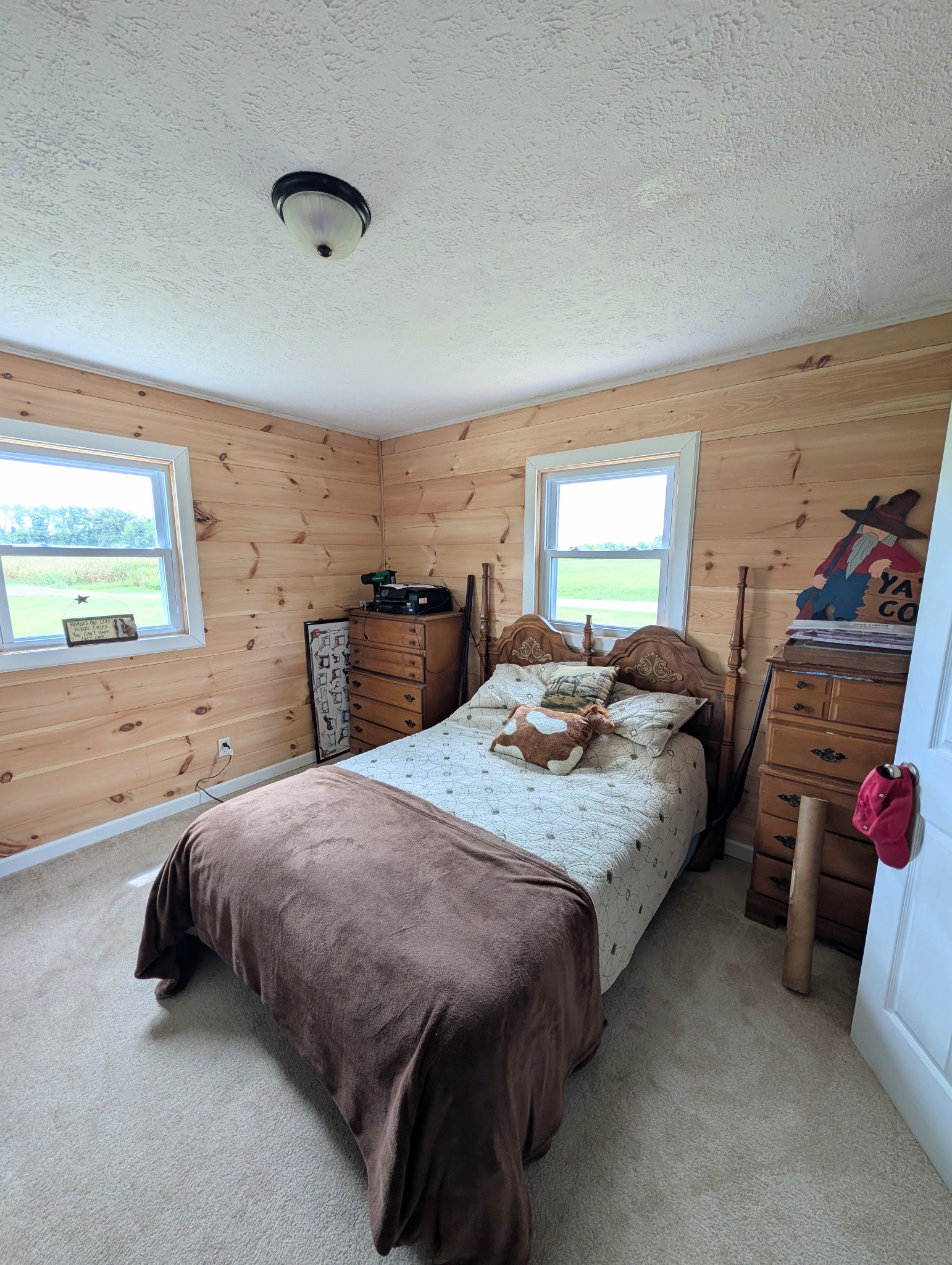 6780 Salubria Springs Road Pembroke, KY 42266 - Photo 12 of 18 a spacious bedroom with a bed and wooden floor
