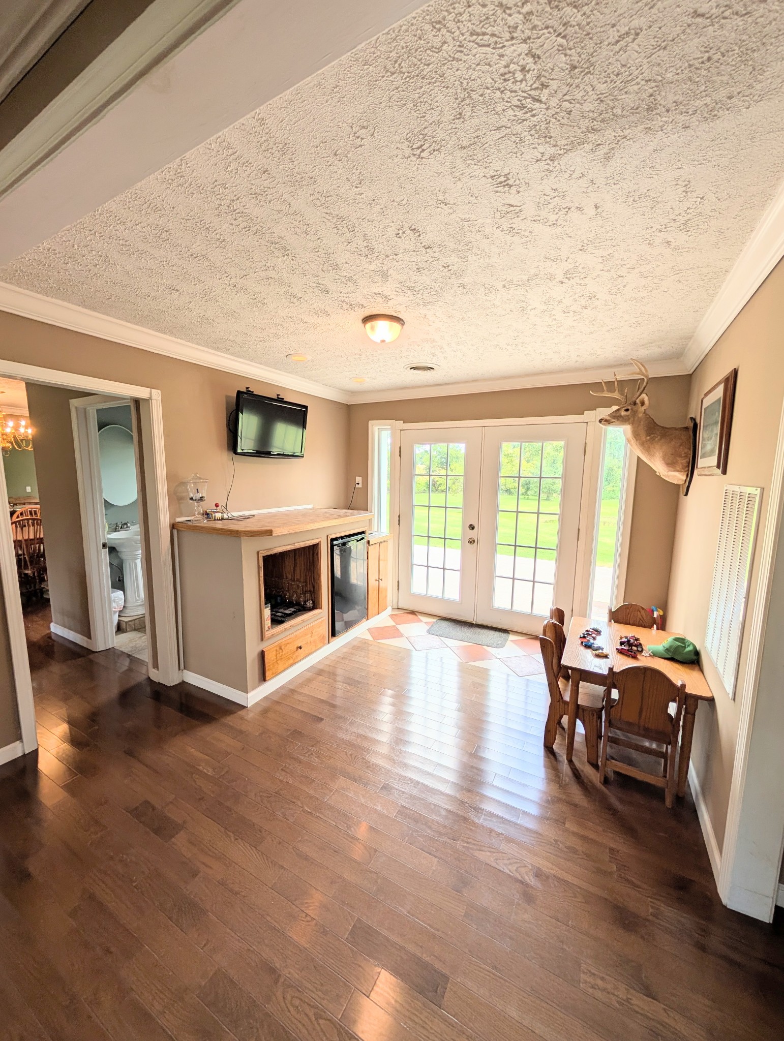 6780 Salubria Springs Road Pembroke, KY 42266 - Photo 15 of 18 a view of a livingroom with furniture a fireplace and wooden floor