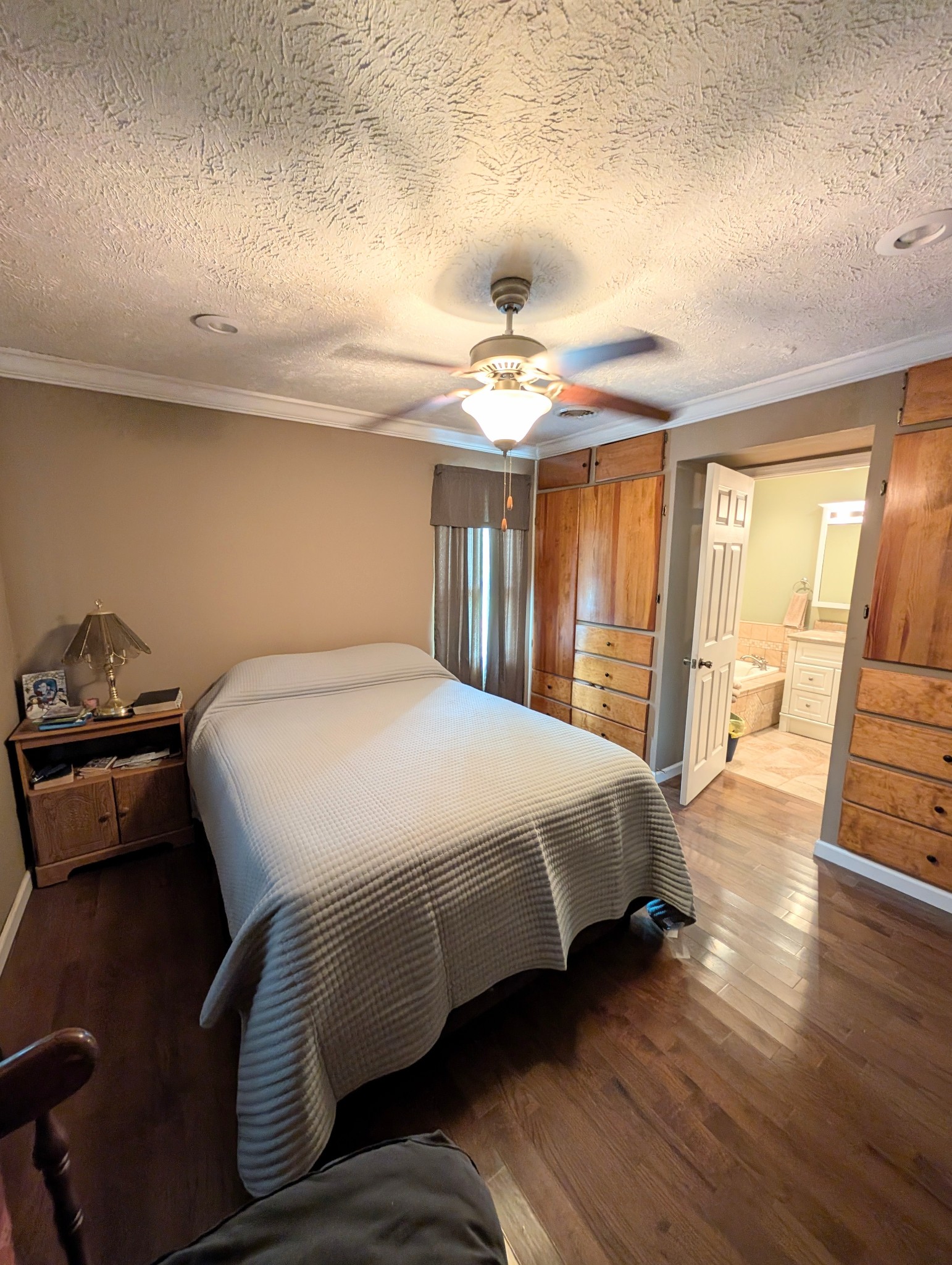6780 Salubria Springs Road Pembroke, KY 42266 - Photo 9 of 18 a bedroom with a bed and wooden floor